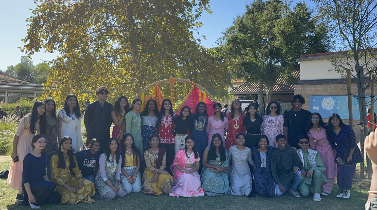Club members gather for a group photo during the Holi celebration